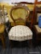 VINTAGE ROUND BACK CHAIR; THIS ROUND BACK CHAIR HAS A CARVED TOP AND CENTER RAIL WITH FLORAL