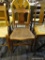 RUSH BOTTOM ARM CHAIR; THIS CHAIR HAS A LADDER BACK WITH TURNED POSTS, TWO ROLLED SIDE ARMS, AND A