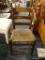 RUSH BOTTOM CHAIR; THIS CHAIR HAS SIMPLE BACK WITH 3 BACK RAILS SUPPORTED BY TWO POSTS WITH TURNED
