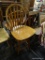 ARROW BACK BAR SEAT; THIS CHAIR HAS AN ARROW BACK ATTACHED TO A SADDLE SEAT THAT SWIVELS ON ITS 4