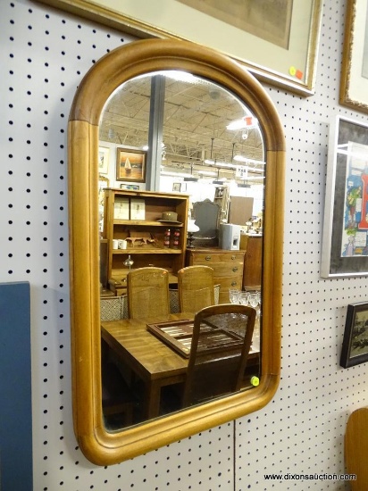 FRAMED MIRROR; MEDIUM SIZED MIRROR WITH ARCHED TOP. THIS MIRROR IS FRAMED IN A WOOD FRAME THAT HAS