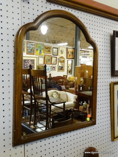 FRAMED WALL MIRROR; MEDIUM SIZED WALL MIRROR THAT IS ALMOST CLOVER SHAPED AT THE TOP. IT IS FRAMED