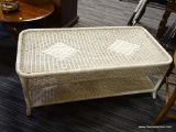 WICKER COFFEE TABLE; WICKER COFFEE TABLE, OFF WHITE IN COLOR WITH LOOSE WOVEN SIDE CURTAINS, A