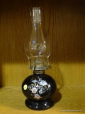 OIL LAMP; LAMPLIGHT FARMS OIL LAMP WITH CLEAR GLASS CHIMNEY, WICK, BLACK BASE WITH FLORAL DETAILING.