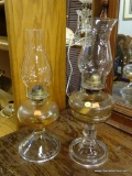 OIL LAMP LOT; SET OF TWO VINTAGE GLASS OIL LAMPS. THESE LAMPS COME WITH CLEAR GLASS CHIMNEYS AND THE