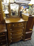 ANTIQUE WOODEN DRESSER; CARVED MIRROR ON A STAND WITH LEAF CARVINGS ATTACHED TO THE TOP OF THIS