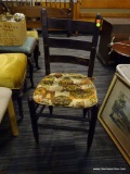 VINTAGE LADDER BACK CHAIR; VINTAGE LADDER BACK CHAIR WITH A WOVEN SEAT THAT HAS AN AMISH COUNTRY
