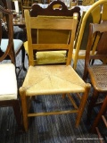 RUSH BOTTOM CHAIR; THIS CHAIR HAS SIMPLE BACK WITH TWO RAILS, A RUSH BOTTOM SEAT AND IT SITS ON 4