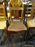 RUSH BOTTOM ARM CHAIR; THIS CHAIR HAS A LADDER BACK WITH TURNED POSTS, TWO ROLLED SIDE ARMS, AND A