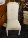 CREAM COLORED SIDE CHAIR; THIS CREAM COLORED CHAIR HAS A TALL, ARCHED, CUSHIONED BACK, AND A LARGE