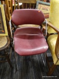 RED PLASTIC CHAIR; THIS CHAIR IS A DARK RED PLASTIC WITH A CHROME LOOK FRAME. IT SITS ATOP CONNECTED