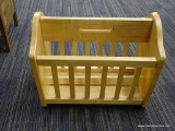 WOODEN MAGAZINE RACK; THIS LIGHT WOOD MAGAZINE RACK HAD A CENTER CARRYING HANDLE, SLATTED FRONT AND