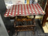 PLAID TOP MAGAZINE RACK TABLE; RICH MAHOGANY PEG CONSTRUCTED SIDE TABLE WITH TURNED LEGS AND