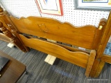VINTAGE WOODEN FULL SIZE BED; SCALLOPED TOP WITH CARVED LEAF IN THE CENTER OF THE HEAD BOARD. THE