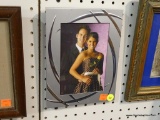 PICTURE FRAME; THIS IS A SILVER TONED PICTURE FRAME THAT HAS POLISHED SILVER ACCENTS. IT FITS 4.5 IN