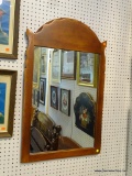 WOOD FRAMED MIRROR; ARCHED TOP, PEG CONSTRUCTION, MEASURES 23.5 IN X 38 IN.