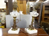 SET OF LAMP BASES; SET OF TWO TABLE LAMP BASES WITH GLASS GLOBES THAT ARE CONNECTED TO BRASS