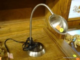 FLEXIBLE LED DESK LAMP; CHROME COLORED DESK LAMP WITH LED LIGHTS AND A FLEXIBLE NECK. THIS LAMP CAN