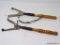 PAIR OF SKEET THROWERS; MADE BY WESTERN, TOTAL OF 2 IN THIS LOT. ONE HAS LEATHER LOOP HANDLE, BOTH