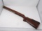 WOODEN GUN STOCK; AL FREELAND WOODEN SHOTGUN STOCK. MEASURES 31 IN LONG. BUTT WIDTH 6 IN.