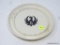 RUGER PORCELAIN ASHTRAY; WHITE PORCELAIN ASHTRAY IS ROUND AND HAS THE BLACK BIRD-LIKE RUGER SYMBOL