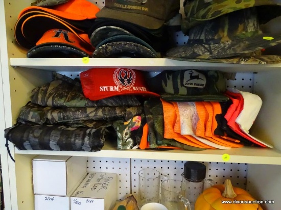 SHELF LOT OF ASSORTED HATS AND OUTERWEAR; INCLUDES 18 BASEBALL STYLE CAPS IN CAMOUFLAGE, BLAZE