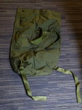 MILITARY-ISSUE SURPLUS DUFFEL BAG AND 4 BASEBALL-STYLE CAPS; BAG IS LIKE NEW ISSUE AND GREEN IN