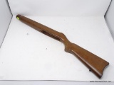WOODEN GUN STOCK; IN EXCELLENT CONDITION. MEASURES 29 IN LONG. WIDTH OF BUTT IS 4.5 IN. PRICE TAG ON
