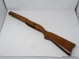 WOODEN GUN STOCK; IN EXCELLENT CONDITION. MEASURES 28 IN LONG. WIDTH OF BUTT IS 5 IN.