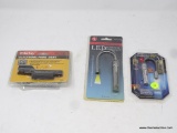 SIGHT AND LIGHTS LOT; INCLUDES 3 TOTAL PIECES. A DAISY ELECTRONIC POINT SIGHT #7809 (FOR MOST AIR