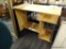 LAMINATE COMPUTER DESK; LIGHT BLONDE WOOD GRAIN LAMINATE; LEFT SIDED KNEEHOLE COMPARTMENT WITH