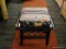 BLACK BAMBOO-LOOK FOOTSTOOL WITH FLORAL PATTERNED TOP; PAINTED BORDER AND BAMBOO DESIGN AROUND SIDES