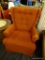 RUST COLORED SWIVEL ARMCHAIR; MADE BY MASTERFIELD FURNITURE, THIS IS A BURNT ORANGE/RUST COLORED