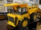 CAT R/C YELLOW TOY DUMP TRUCK; WELL-LOVED TOY TRUCK WITH WORKING DUMPING MECHANISM. PIECE IS MISSING