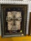 (WALL) FRAMED CROSS DECOR; BLACK, CREAM, AND GOLD WITH TEXTURED CROSS IMAGE IN CENTER. MEASURES 13