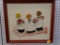 (WALL2) FRAMED EMBROIDERY DECOR; DEPICTS 3 CHOIR BOYS. IN A WOODEN FRAME MEASURES 13 IN X 21 IN