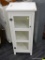 WHITE SINGLE DOOR CABINET; HAS 3 INTERIOR SHELVES AND HAS 3 GLASS PANES ON THE DOOR. GREAT FOR