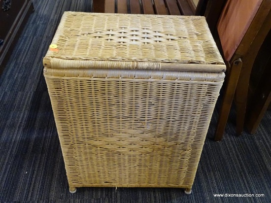 LAUNDRY BASKET; TAN WICKER LAUNDRY BASKET WITH LIFT TOP LID. MEASURES 18 IN X 12 IN X 23 IN