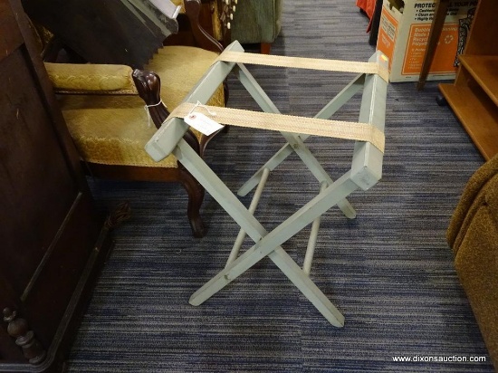 VINTAGE FOLDING LUGGAGE RACK; PAINTED SAGE GREEN WITH FABRIC MESH STRAPS. MEASURES 21 IN X 17.5 IN X