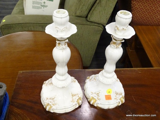 CANDLESTICK HOLDERS; PAIR OF VINTAGE ELEGANT WHITE PORCELAIN CANDLESTICKS WITH GOLD PAINTED ACCENTS.