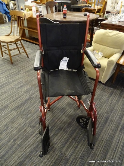 WHEELCHAIR; DRIVE MEDICAL BURGUNDY COLORED METAL WHEELCHAIR WITH CUSHIONED ARM RESTS AND LOWER