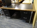 LARGE BLACK METAL DESK WITH WOODGRAIN LAMINATE TOP SURFACE; DOUBLE PEDESTAL DESIGN WITH A CENTER