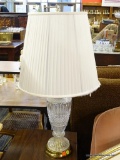 CUT GLASS BASE TABLE LAMP; WITH BRASS FINIAL AND PLEATED WHITE DRUM SHAPED LAMPSHADE (HAS SOME