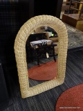 WICKER FRAMED MIRROR; NATURAL WICKER COLOR WITH BOWED TOP, MEASURES 30 IN TALL AND 20 IN WIDE.