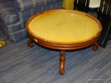 ROUND COFFEE/COCKTAIL TABLE; WOODEN FRAME, PREVIOUSLY HAD A CENTER PANEL, BUT IS NOW OPEN IN MIDDLE.