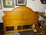 ARCHED TOP PANEL HEADBOARD; IS A KING SIZE. IN GOOD USED CONDITION AND HAS BOLTS FOR RAILS (RAILS