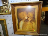 (WALL) FRAMED CHILD PRINT; DEPICTS A YOUNG BOY GIVING AND A GIRL RECEIVING A KISS ON THE CHEEK.