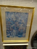 (WALL) FRAMED JOHN POWELL FLORAL IMAGE; CREAM COLORED BORDER IN GOLD COLORED FRAME. MEASURES 24 IN X