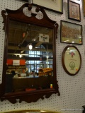 (WALL2) FRAMED MIRROR; IN A CHIPPENDALE STYLE MAHOGANY FRAME WITH BROKEN ARCH PEDIMENT TOP. MEASURES