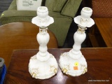 CANDLESTICK HOLDERS; PAIR OF VINTAGE ELEGANT WHITE PORCELAIN CANDLESTICKS WITH GOLD PAINTED ACCENTS.